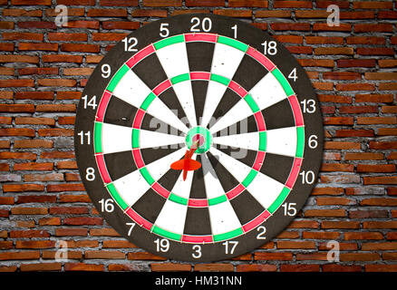 Dartboard on brick wall (Darts Hit Target) Stock Photo