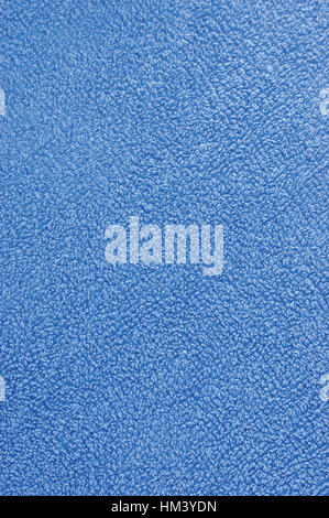 Blue plush terry cloth turkish bath towel, macro background closeup vertical Stock Photo