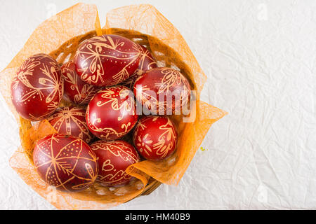 Wax painted red Easter eggs Stock Photo