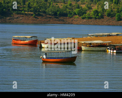 Boating, Koyna dam backwaters. Tapola, Maharasthra, India. The Koyna Dam is one of the largest dams in Maharashtra, India. It is a rubble-concrete dam Stock Photo