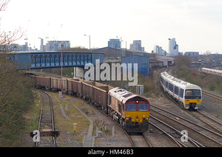 A freight train unloading at the Neasden freight terminal in west London. Stock Photo