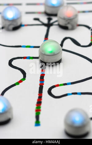 Colourful Ozobots on hand drawn code path. Stock Photo