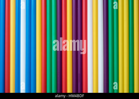 colored tubules for a cocktail in the background Stock Photo