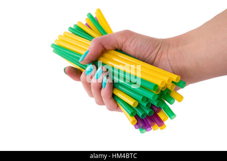 bunch of colored tubules for a cocktail in a female hand Stock Photo