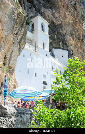 Ostrog, Montenegro - 27 June 2014: believers lined up for the visit of the Ostrog monastery near Danilovgrad on Montenegro Stock Photo