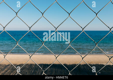 Seaview through the metal grid Stock Photo