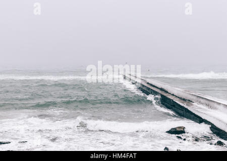Views of the snow-covered pier, winter seascape Stock Photo