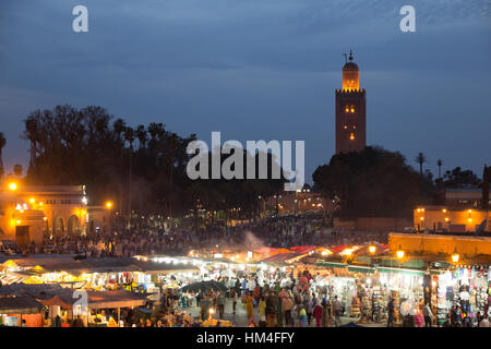 Evening view on the Djemaa el Fna square and the Koutoubia mosque, Marrakech, Morocco Stock Photo