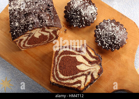 Swirl cake with chocolate on wooden board Stock Photo