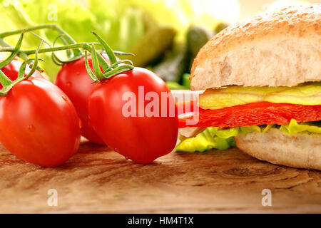 Vegetarian sandwich on wooden background Stock Photo