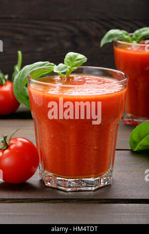 Fresh healthy tomato smoothie juice on wooden background Stock Photo