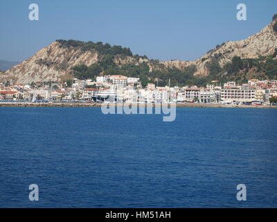 A trip around Zakynthos island. Lots of cliffs, rocks, stones and pure clear azure sea. Area visible just by boat. Unspoiled nature. Small settlement. Stock Photo