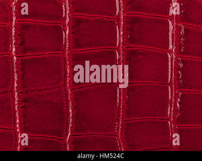 Abstract texture of synthetic leather, red background. Stock Photo