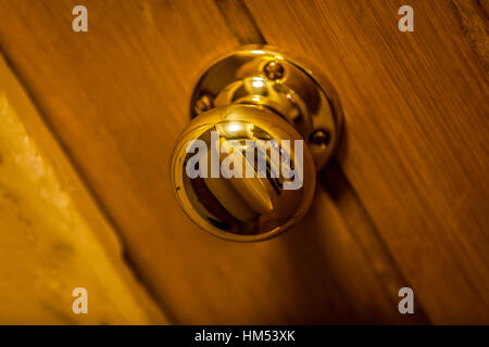 Golden door knob on wooden doors Stock Photo