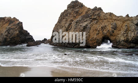 BIG SUR, CALIFORNIA, UNITED STATES - OCT 7, 2014: Huge ocean waves crushing on rocks at Pfeiffer State Park in CA along Highway No 1, USA Stock Photo