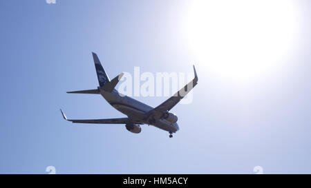 LOS ANGELES, CALIFORNIA, USA - OCT 9th, 2014: Alaska Airlines Boeing 737 shown shortly before landing at the LA Airport LAX Stock Photo