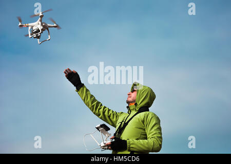 Man operating a drone Stock Photo