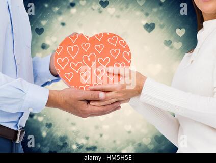 Mid section of couple holding a gift Stock Photo