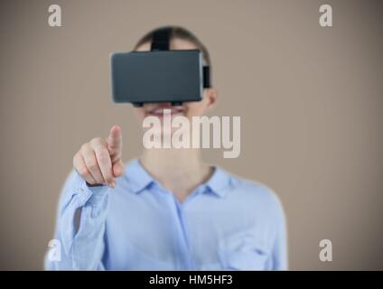 Smiling businesswoman using virtual reality headset Stock Photo