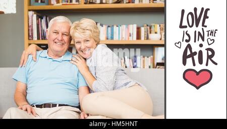 Happy senior couple relaxing in bed Stock Photo
