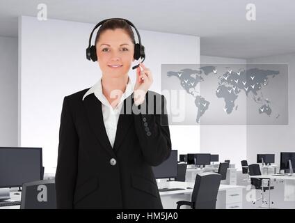 Portrait of smiling businesswoman with headset in office Stock Photo