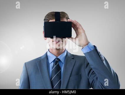 Businessman using virtual reality headset Stock Photo