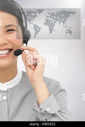 Female executive talking on headphones Stock Photo