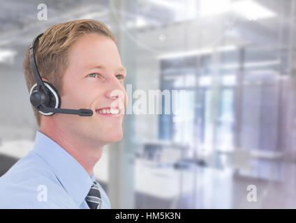 Smiling businessman with headset in office Stock Photo