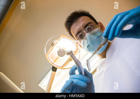 Directly below shot of dentist working in clinic Stock Photo