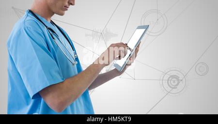 Doctor using digital tablet against digitally generated background Stock Photo