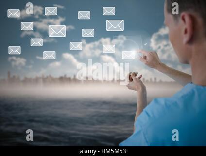 Doctor touching digitally generated email icon on virtual screen Stock Photo
