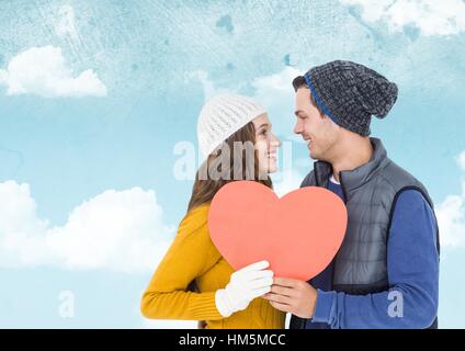 Romantic couple holding heart shape and kissing each other Stock Photo ...