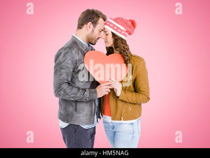 Romantic couple holding a red heart Stock Photo