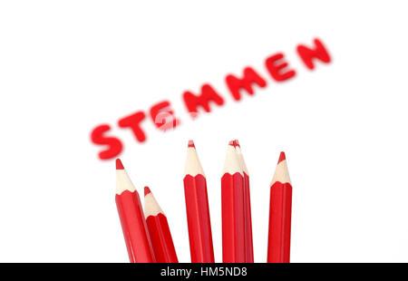 Red pencils and the word stemmen which means to vote in dutch for the upcoming elections on march 15, 2017 in the Netherlands Stock Photo