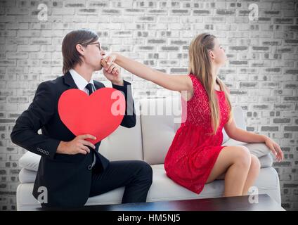 Man holding heart shape kissing on womans hand Stock Photo