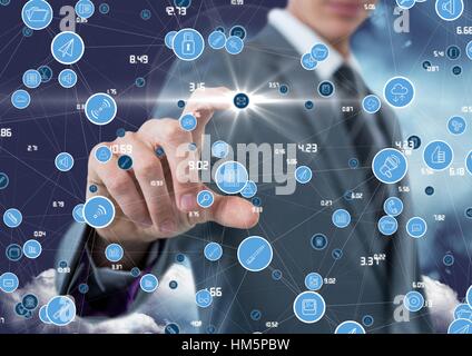 Businessman touching digitally generated connecting icons Stock Photo