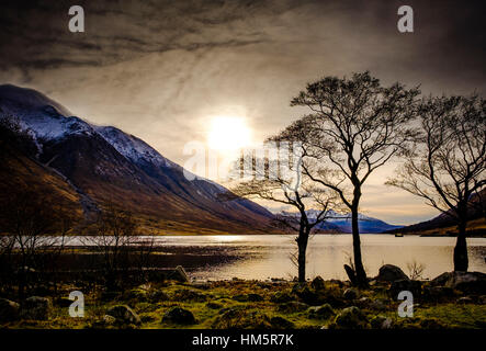 Winter sun over Loch Etive at the end of Glen Etive, Scotland in winter Stock Photo