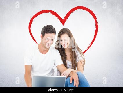 Happy couple using laptop Stock Photo