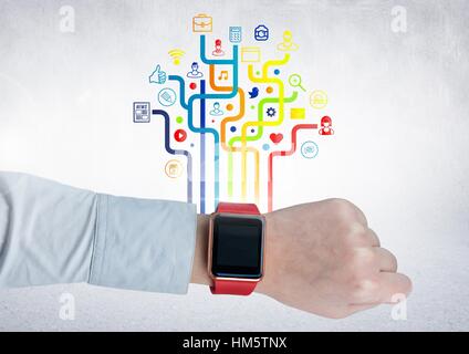 Mans wrist with smartwatch against digitally generated application icons Stock Photo