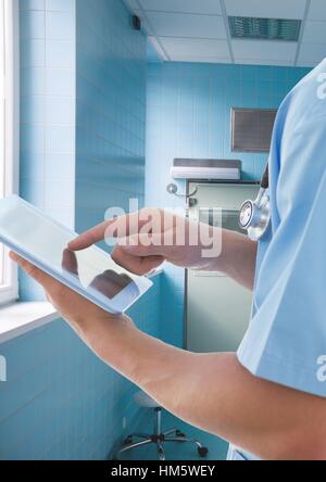 Doctor using digital tablet in hospital Stock Photo
