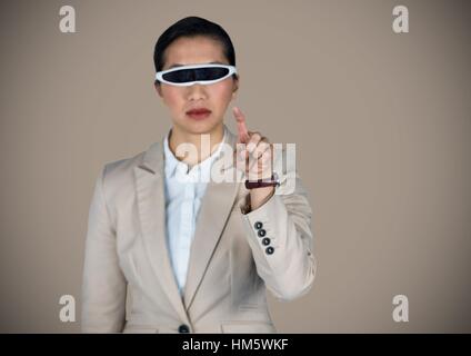 Businesswoman using virtual reality headset Stock Photo