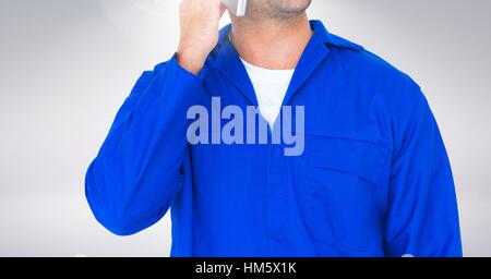 Mid section of serviceman talking on mobile phone Stock Photo