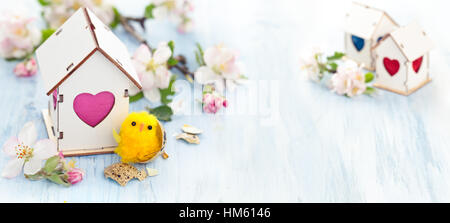 White Wood houses with colorful heart shaped windows. Stock Photo