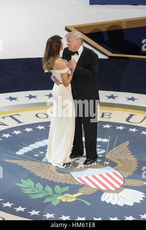 U.S. President Donald Trump dances with First Lady Melania Trump during the Salute to Our Armed Services Ball at the National Building Museum January 20, 2017 in Washington, DC. Stock Photo