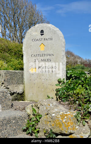 Stone way marker on the South West Coastal Path, Island of Portland, Dorset, UK Stock Photo