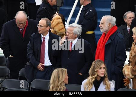 New England Patriots owner Robert Kraft, center, blows a kiss after arriving for the President Inaugural Ceremony on Capitol Hill January 20, 2017 in Washington, DC. Donald Trump became the 45th President of the United States in the ceremony. Standing with Kraft are Rudy Giuliani, left, son Patrick Kraft and Billionaire Carl Icahn, right. Stock Photo