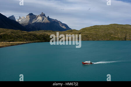 A boat in Pehoe Lake near Paine Grande in Torres del Paine National Park Chile. Stock Photo