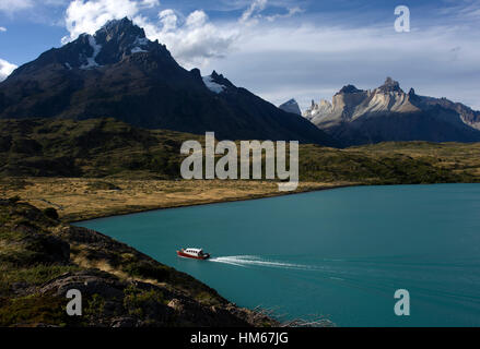 A boat in Pehoe Lake near Paine Grande in Torres del Paine National Park Chile. Stock Photo