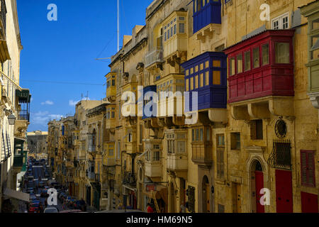 Hilly steep side streets Valletta Malta balcony balconies traditional old wooden tourist attraction colorful colourful RM World Stock Photo