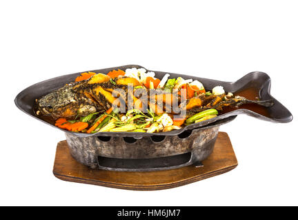 Sour curry with deep-fried snake headed fish Stock Photo